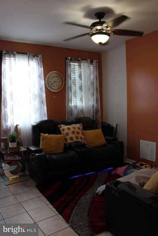 3028 North 4th Street Philadelphia, PA 19133 - Photo 4 of 15 a bedroom with a bed and a chandelier