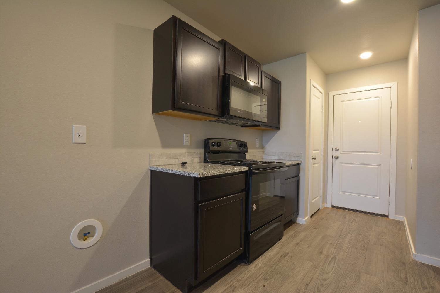 7513 28th Street Lubbock, TX 79407 - Photo 8 of 18 a room with a sink cabinets and a mirror