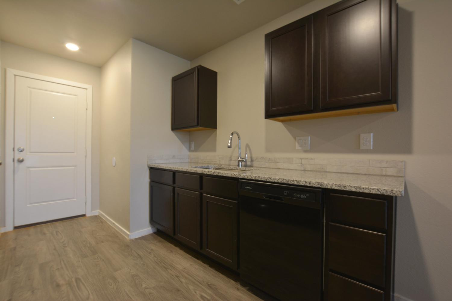 7513 28th Street Lubbock, TX 79407 - Photo 9 of 18 a bathroom with a sink and a mirror