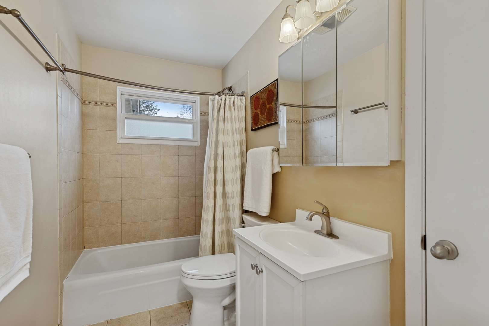151 Walton Street Barrington, IL 60010 - Photo 12 of 22 a bathroom with a sink toilet and shower