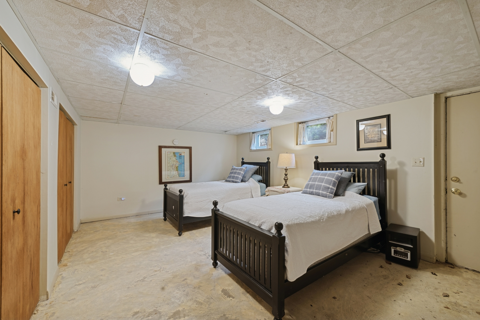 151 Walton Street Barrington, IL 60010 - Photo 16 of 22 a bedroom with a bed and a chandelier