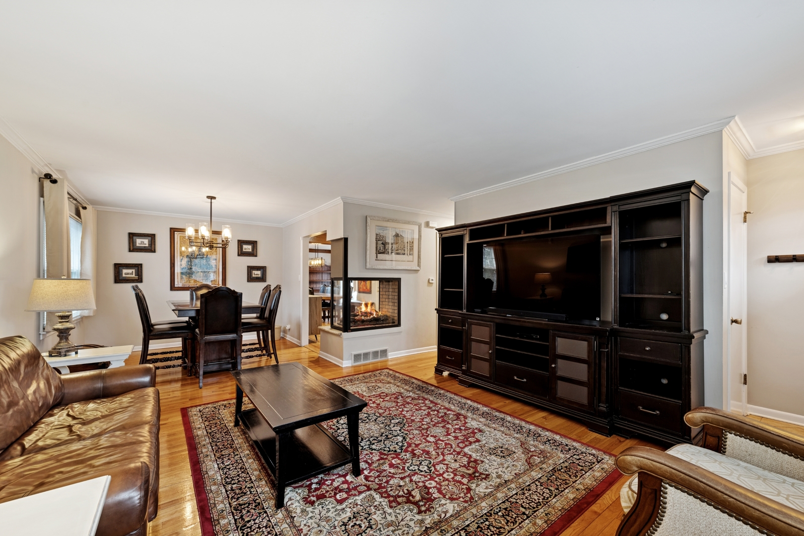 151 Walton Street Barrington, IL 60010 - Photo 3 of 22 a living room with furniture and a flat screen tv