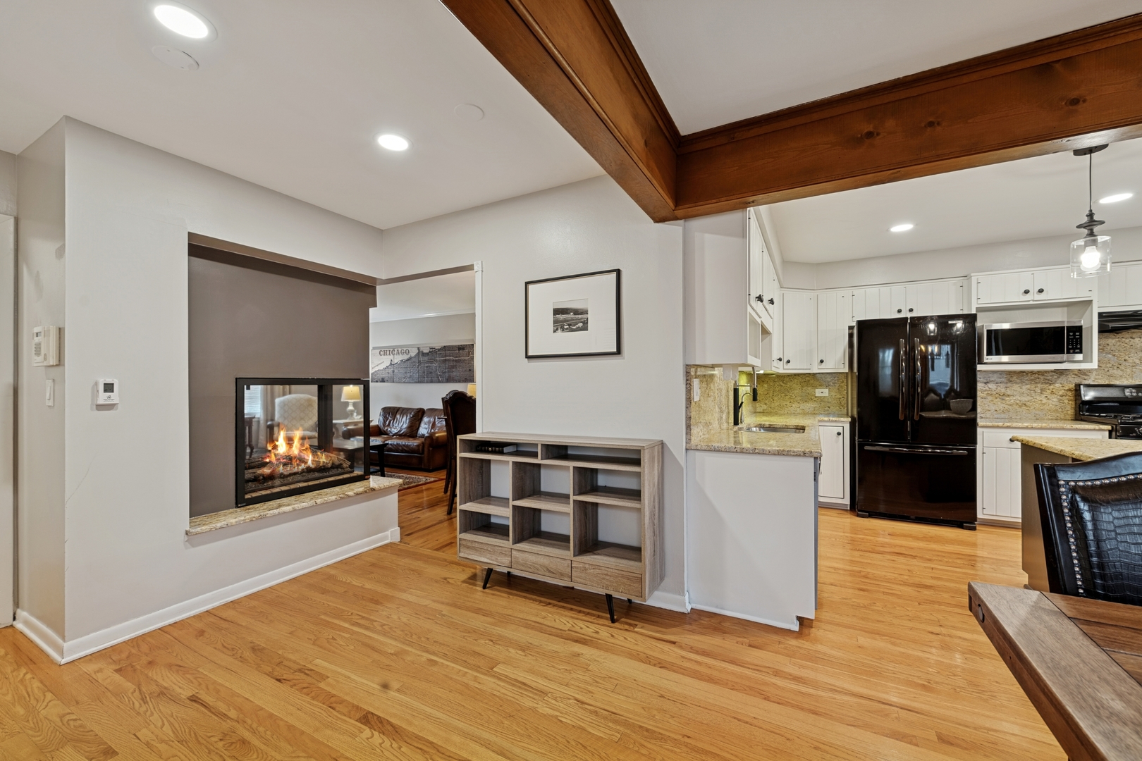 151 Walton Street Barrington, IL 60010 - Photo 6 of 22 a view of a kitchen with refrigerator and wooden floor