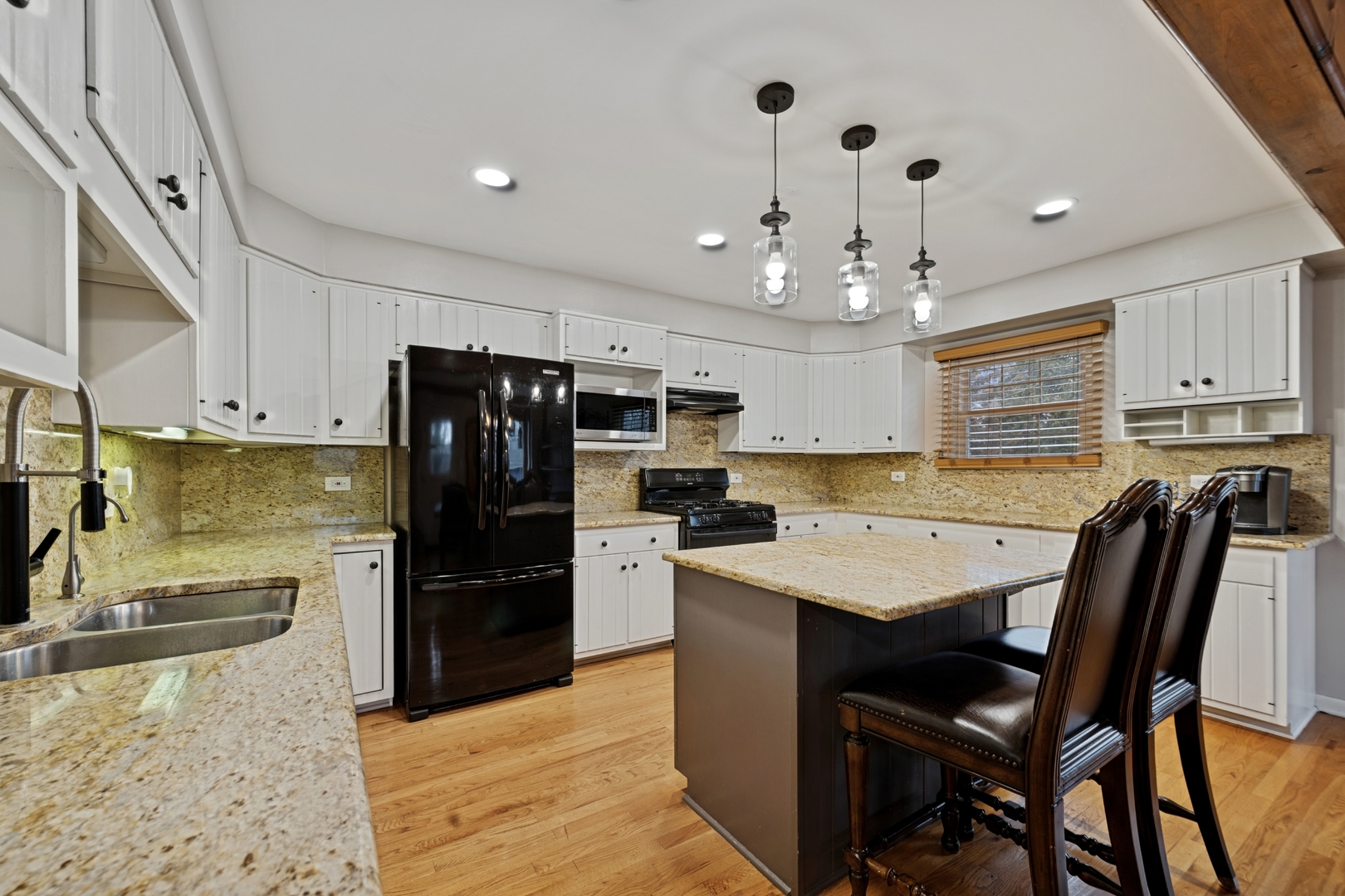 151 Walton Street Barrington, IL 60010 - Photo 9 of 22 a kitchen with a refrigerator a stove a sink and dishwasher with wooden floor