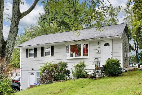 a aerial view of a house with a yard and plants