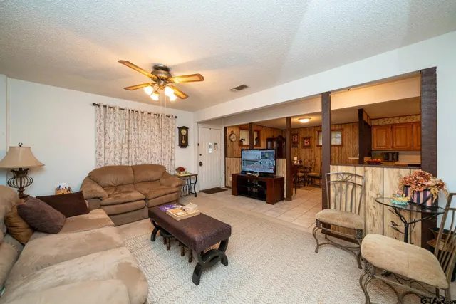 a living room with furniture and a window