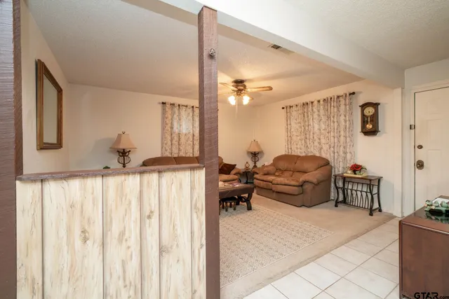 a dining room with furniture and window