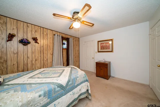 a kitchen with stainless steel appliances granite countertop a refrigerator and a stove