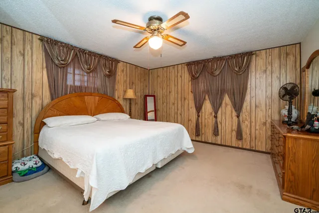 a bathroom with a tub sink and toilet