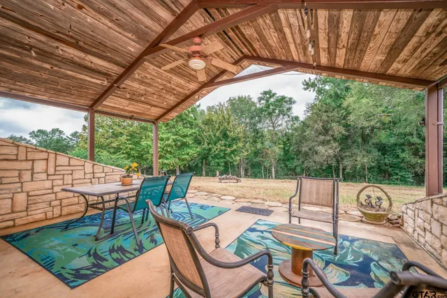 a view of an outdoor sitting area with furniture