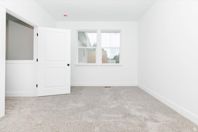 314 North 200 West Logan, UT 84321 - Photo 31 of 37 Spare room with light colored carpet and baseboards