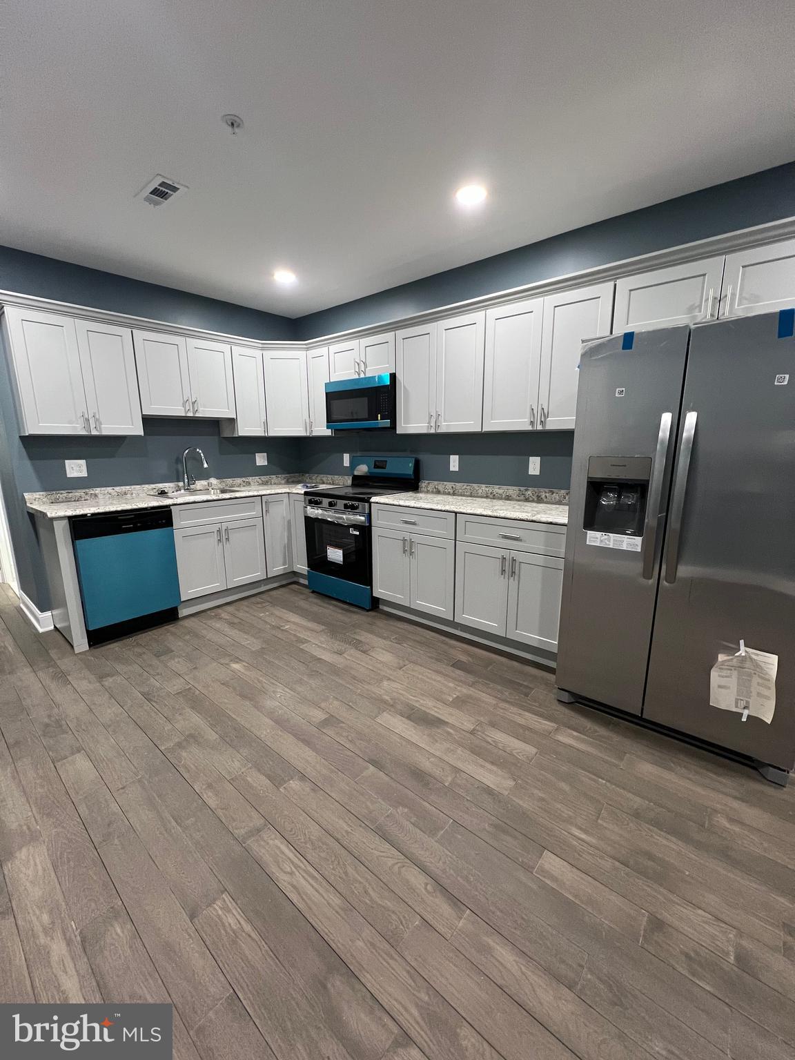 2020 McCulloh Street, Unit 2 Baltimore, MD 21217 - Photo 4 of 12 a kitchen with stainless steel appliances granite countertop a refrigerator sink and stove