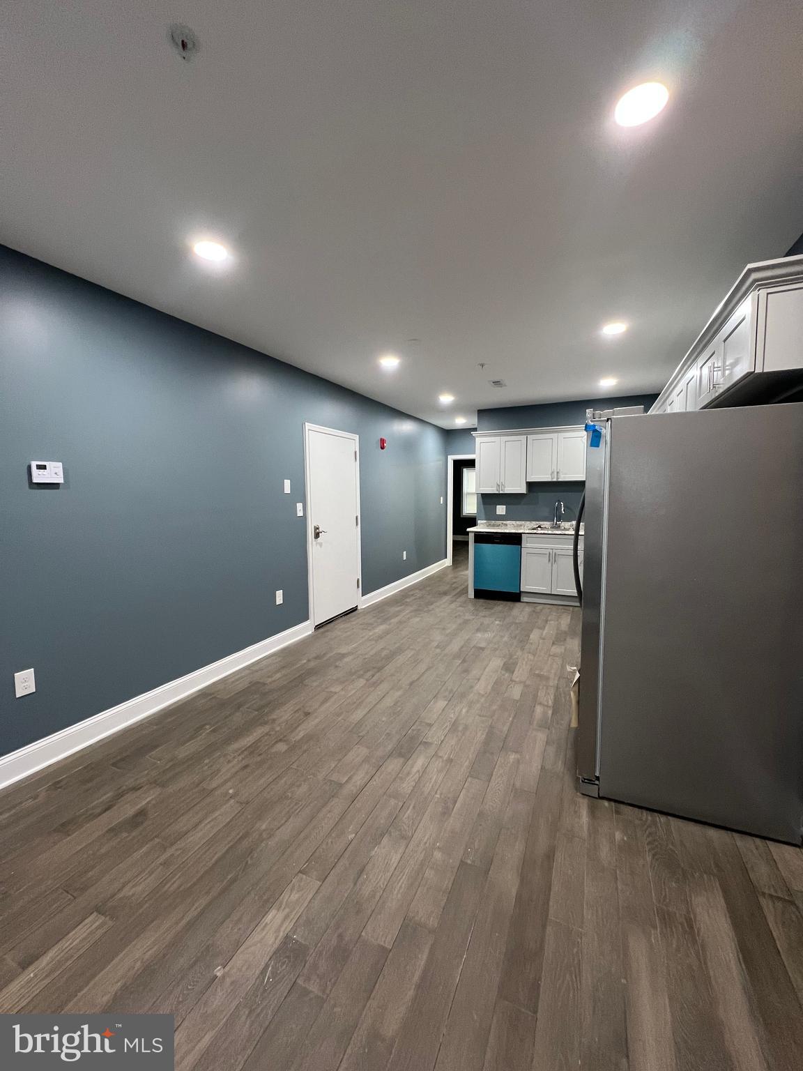 2020 McCulloh Street, Unit 2 Baltimore, MD 21217 - Photo 5 of 12 a view of a big room with wooden floor