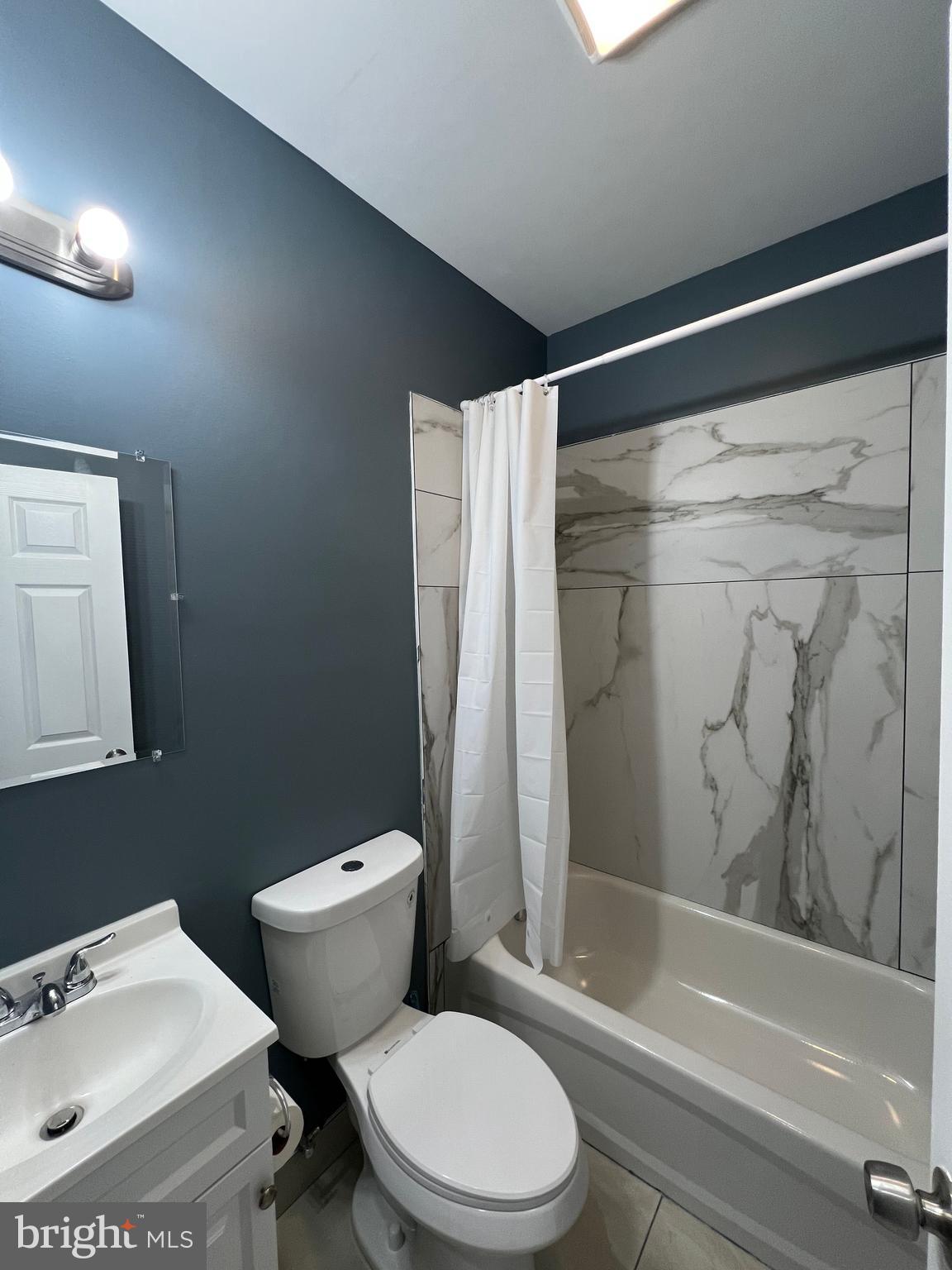 2020 McCulloh Street, Unit 2 Baltimore, MD 21217 - Photo 6 of 12 a bathroom with a sink toilet and shower