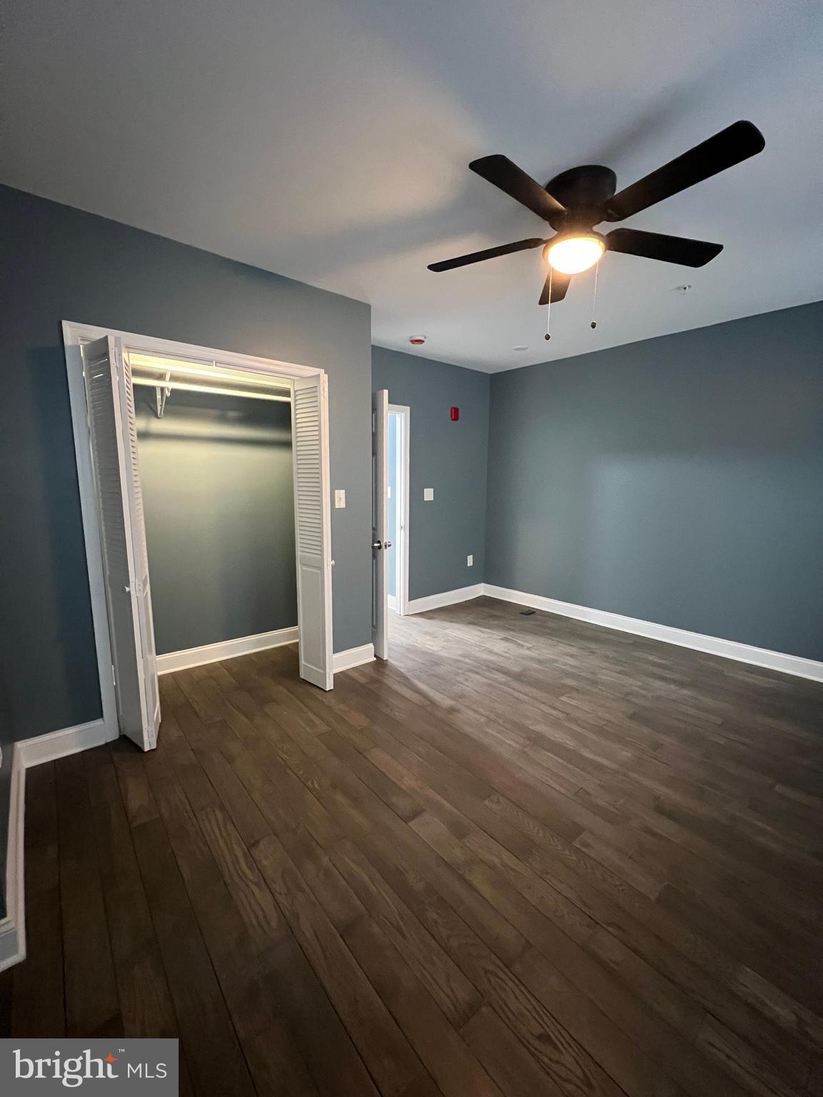 2020 McCulloh Street, Unit 2 Baltimore, MD 21217 - Photo 8 of 12 an empty room with wooden floor and windows