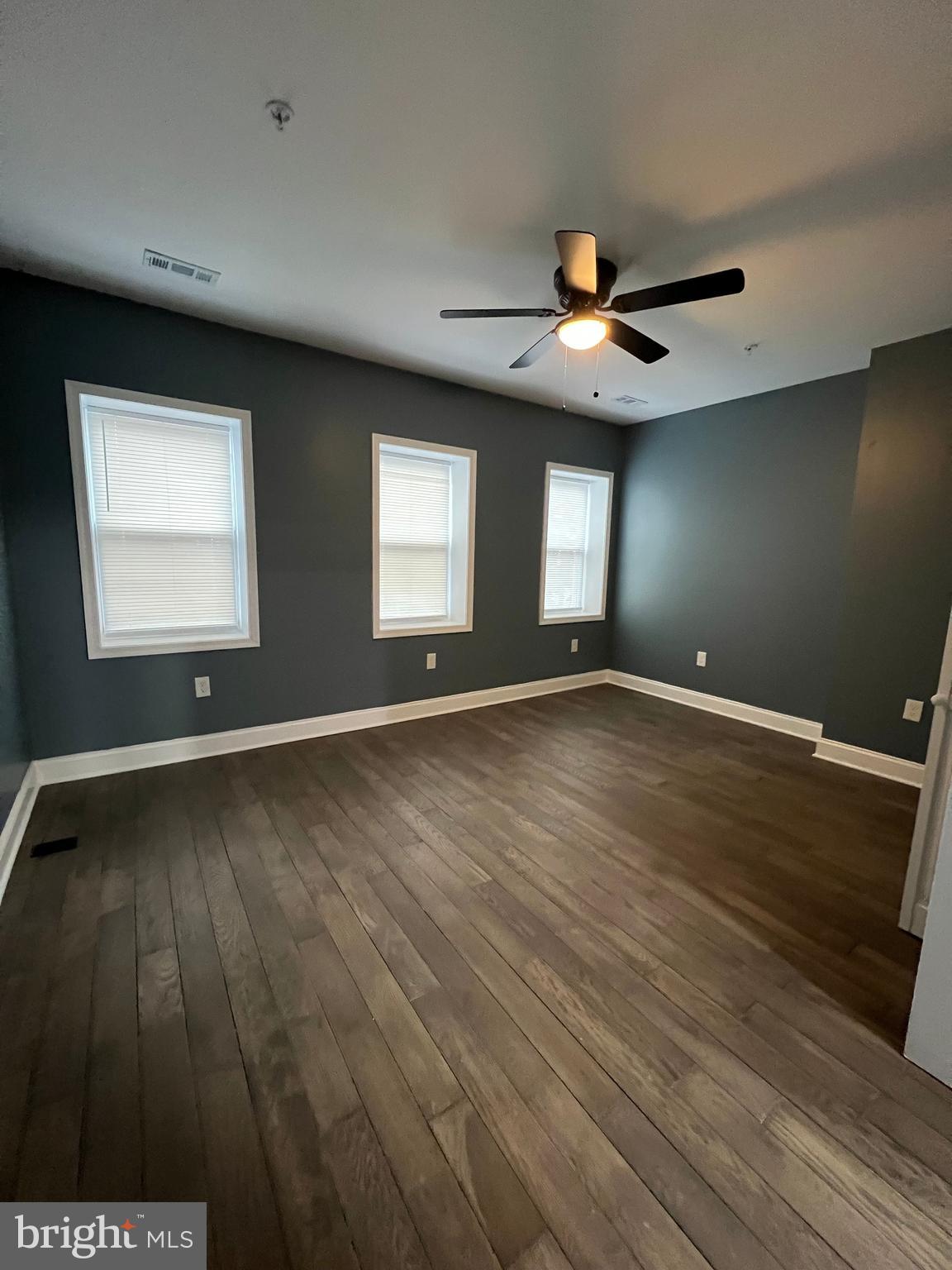 2020 McCulloh Street, Unit 2 Baltimore, MD 21217 - Photo 9 of 12 a view of an empty room with window and wooden floor