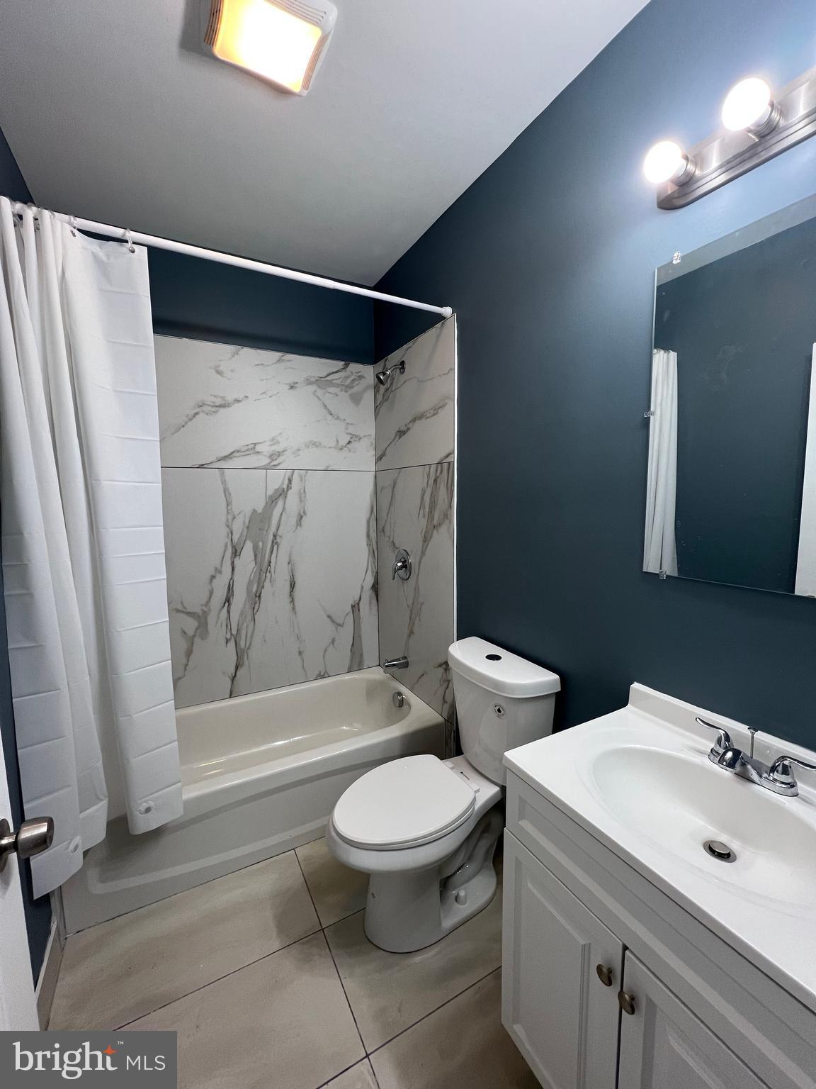 2020 McCulloh Street, Unit 2 Baltimore, MD 21217 - Photo 10 of 12 a bathroom with a toilet sink and shower