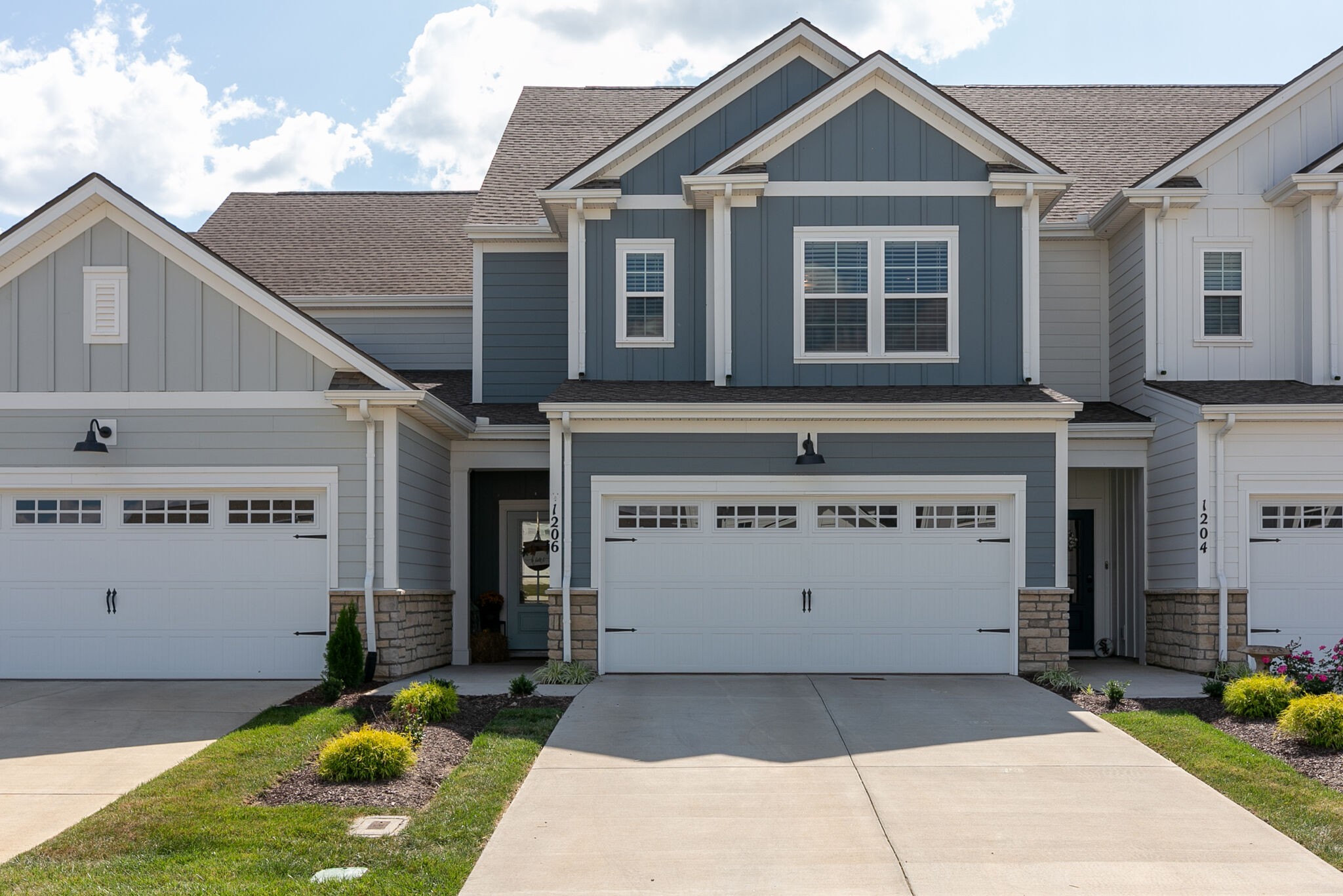 1206 June Wilde Ridge Spring Hill, TN 37174 - Photo 1 of 43 a view of a house with a yard and potted plants