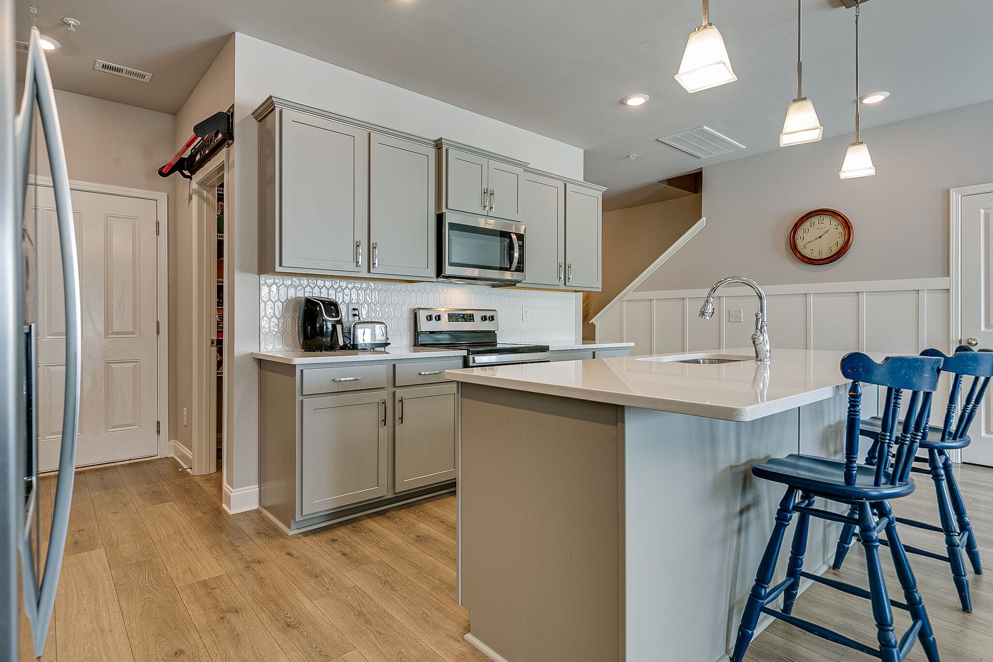 1206 June Wilde Ridge Spring Hill, TN 37174 - Photo 12 of 43 a kitchen with a sink cabinets and stainless steel appliances