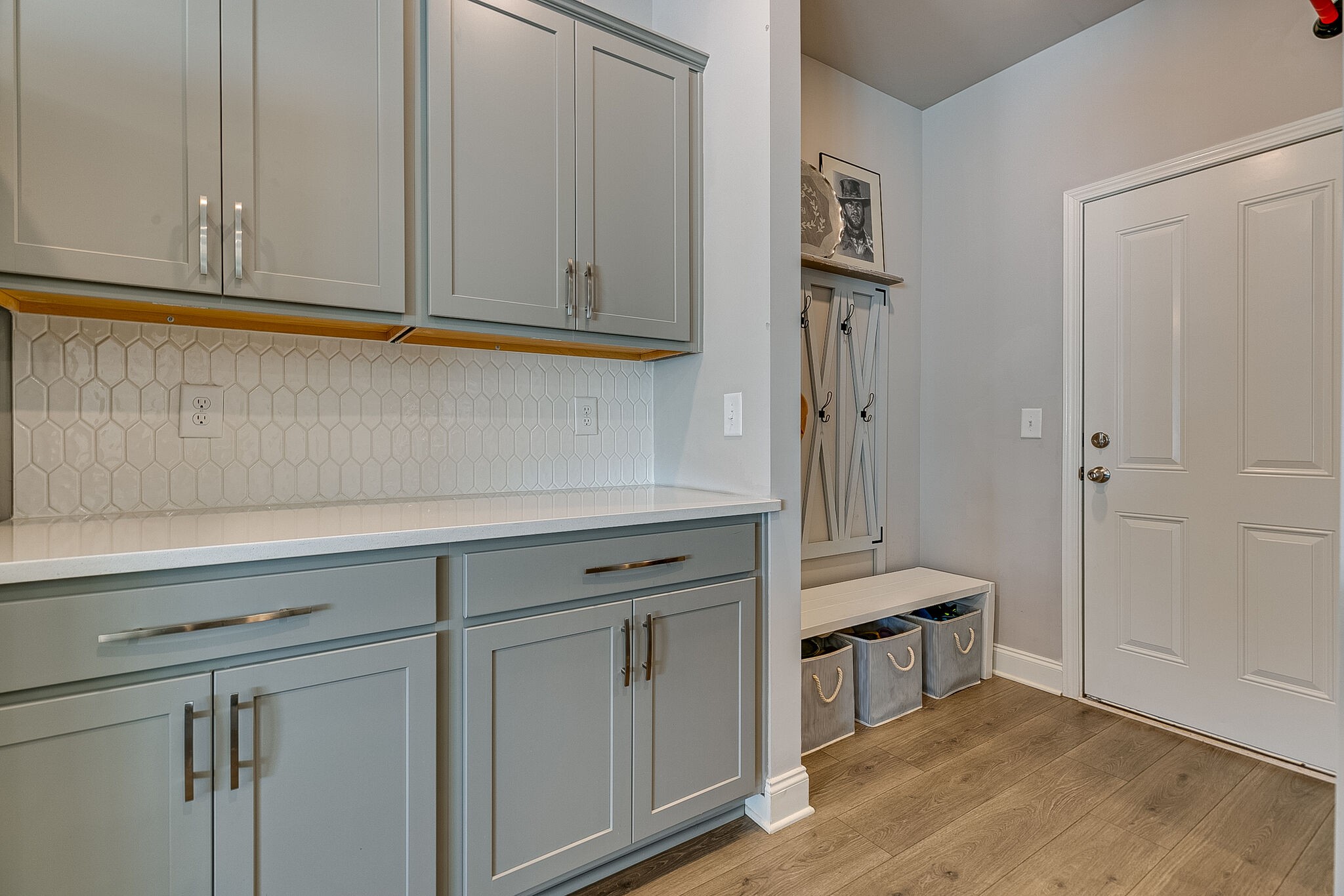 1206 June Wilde Ridge Spring Hill, TN 37174 - Photo 13 of 43 a kitchen with stainless steel appliances white cabinets and a sink