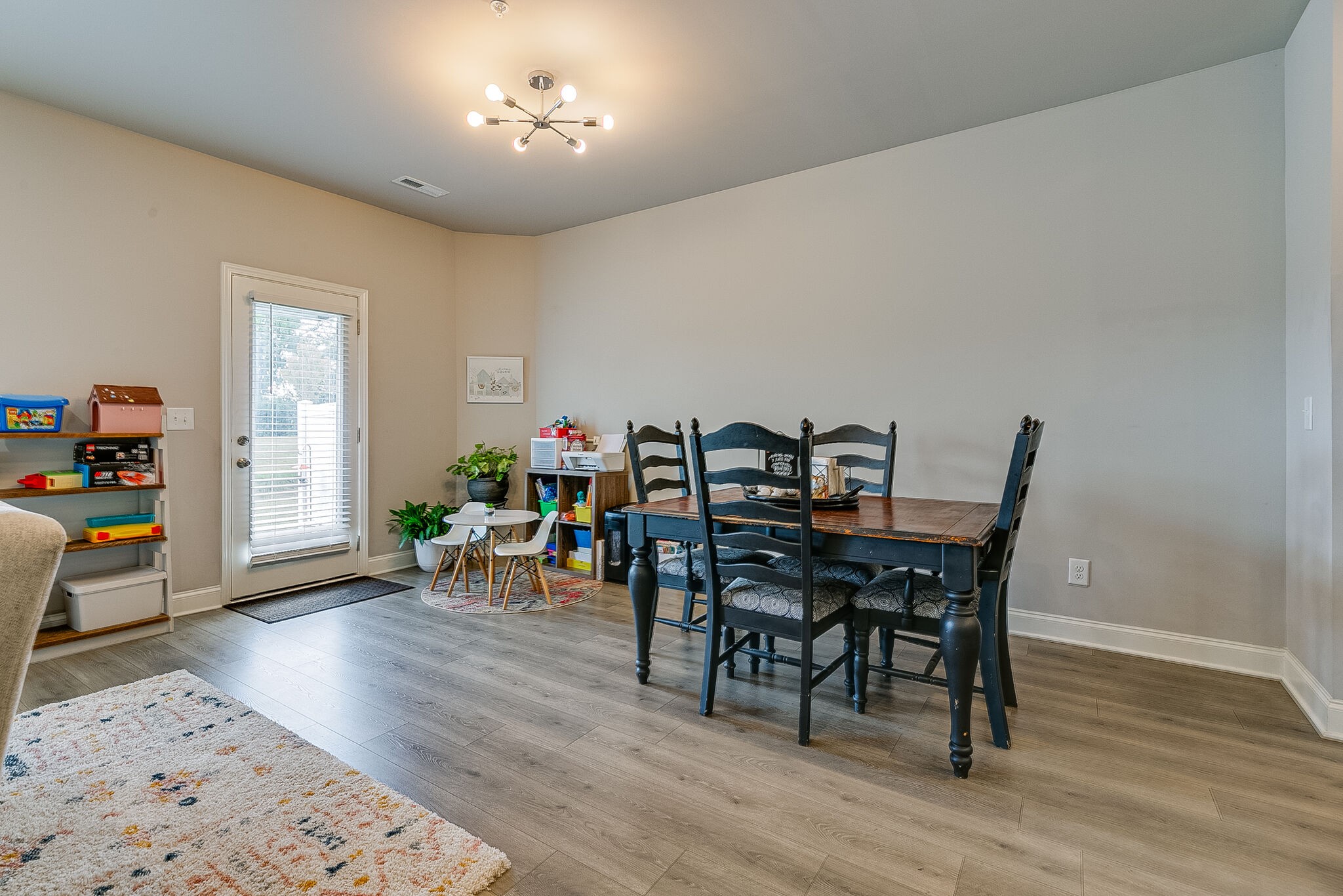 1206 June Wilde Ridge Spring Hill, TN 37174 - Photo 18 of 43 a view of a dining room with furniture and wooden floor
