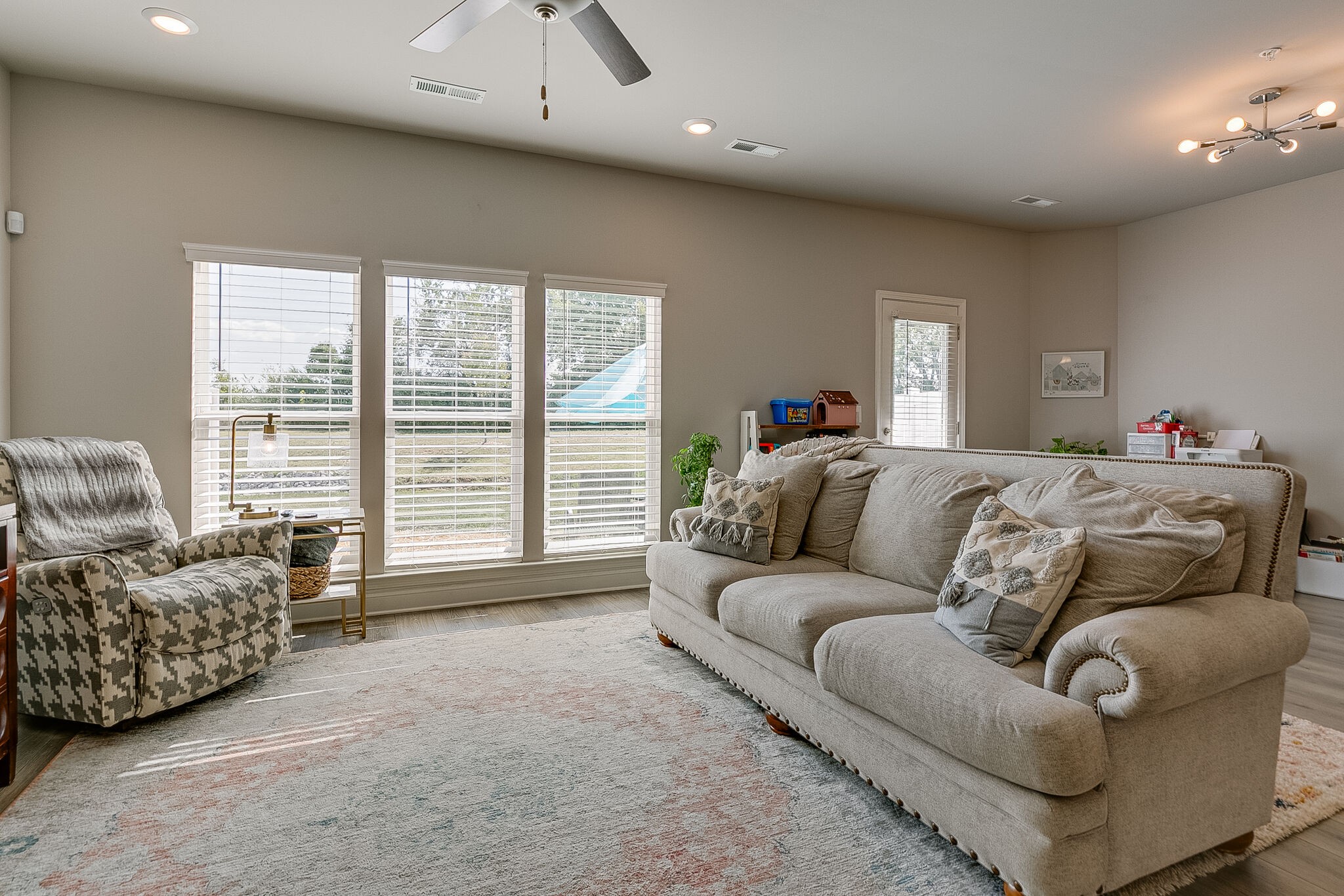 1206 June Wilde Ridge Spring Hill, TN 37174 - Photo 20 of 43 a living room with furniture and a large window