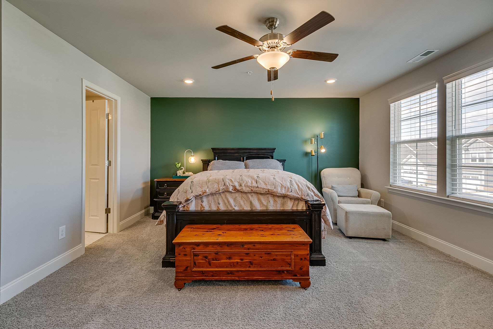 1206 June Wilde Ridge Spring Hill, TN 37174 - Photo 28 of 43 a bedroom with a bed and a chandelier