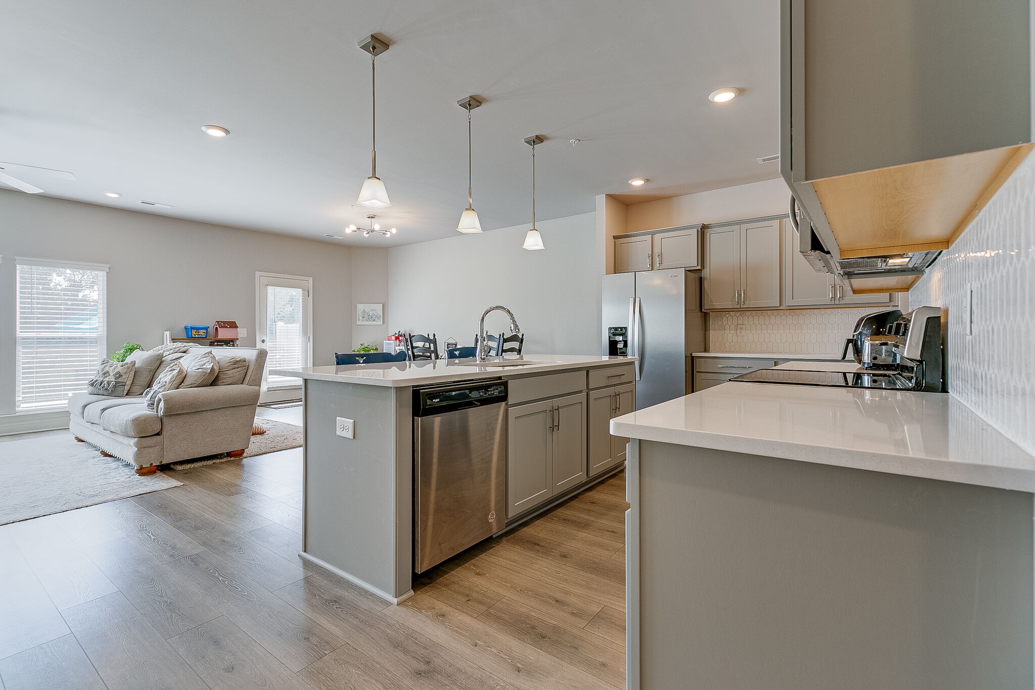 1206 June Wilde Ridge Spring Hill, TN 37174 - Photo 8 of 43 a kitchen with stainless steel appliances a sink a stove a refrigerator and cabinets