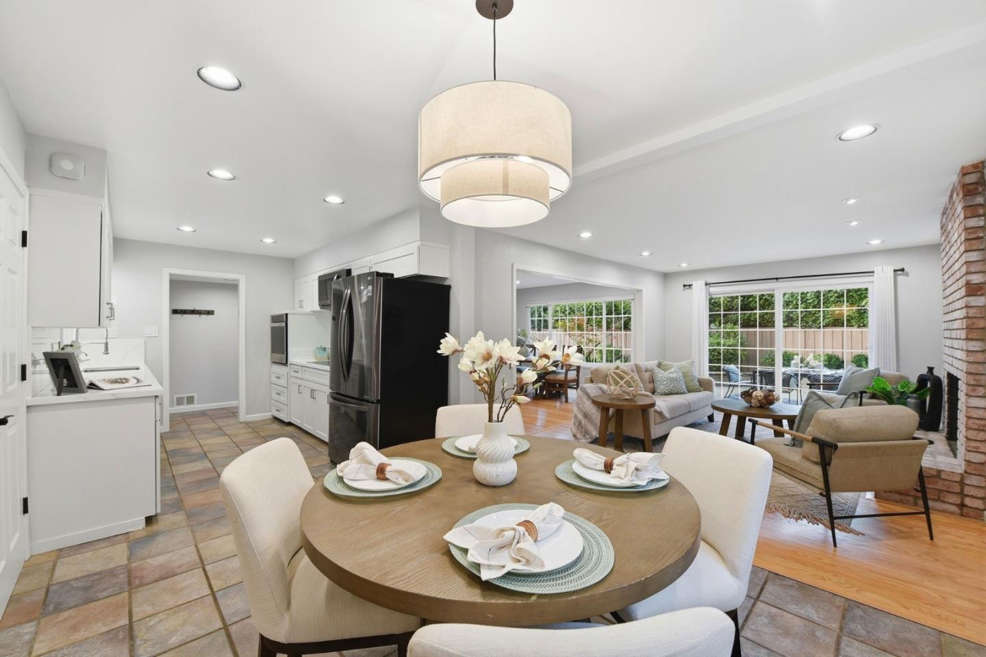 1663 Curtner Avenue San Jose, CA 95125 - Photo 13 of 57 a dining room with furniture a chandelier and wooden floor