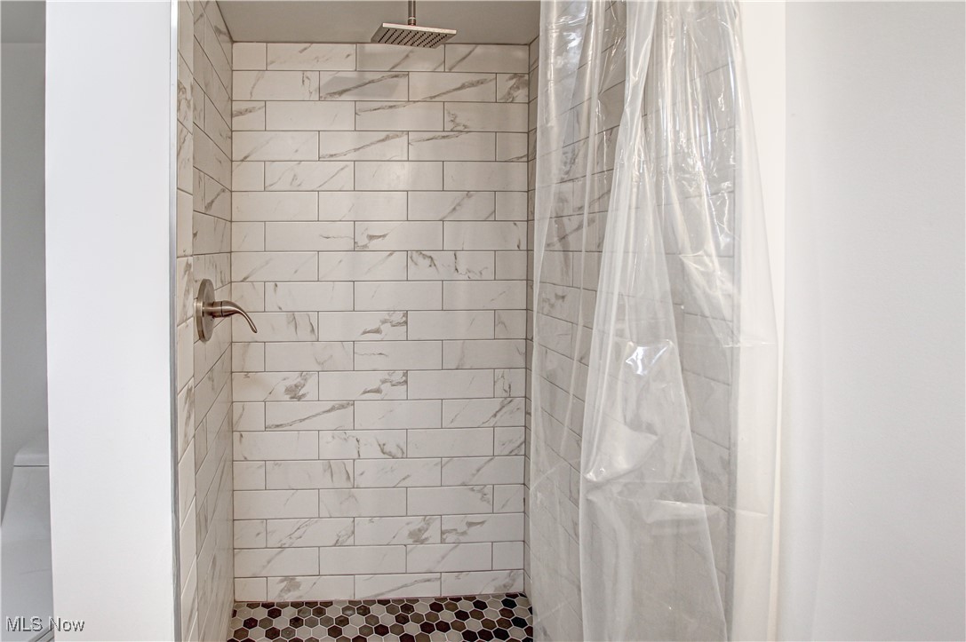 12477 Webster Road Strongsville, OH 44136 - Photo 33 of 40 Bathroom with a shower with shower curtain