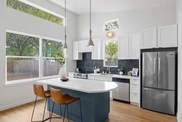 a wooden bench sitting in front of a door