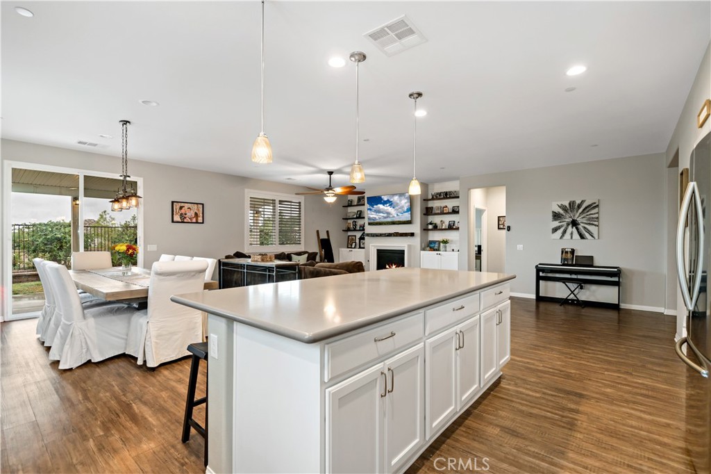 30640 Lone Pine Drive Menifee, CA 92584 - Photo 16 of 48 a large kitchen with kitchen island a white counter space