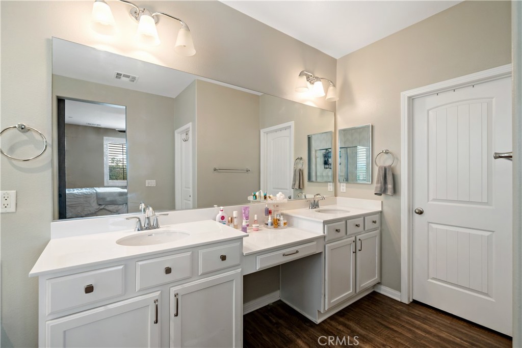 30640 Lone Pine Drive Menifee, CA 92584 - Photo 27 of 48 a bathroom with a sink double vanity and a mirror