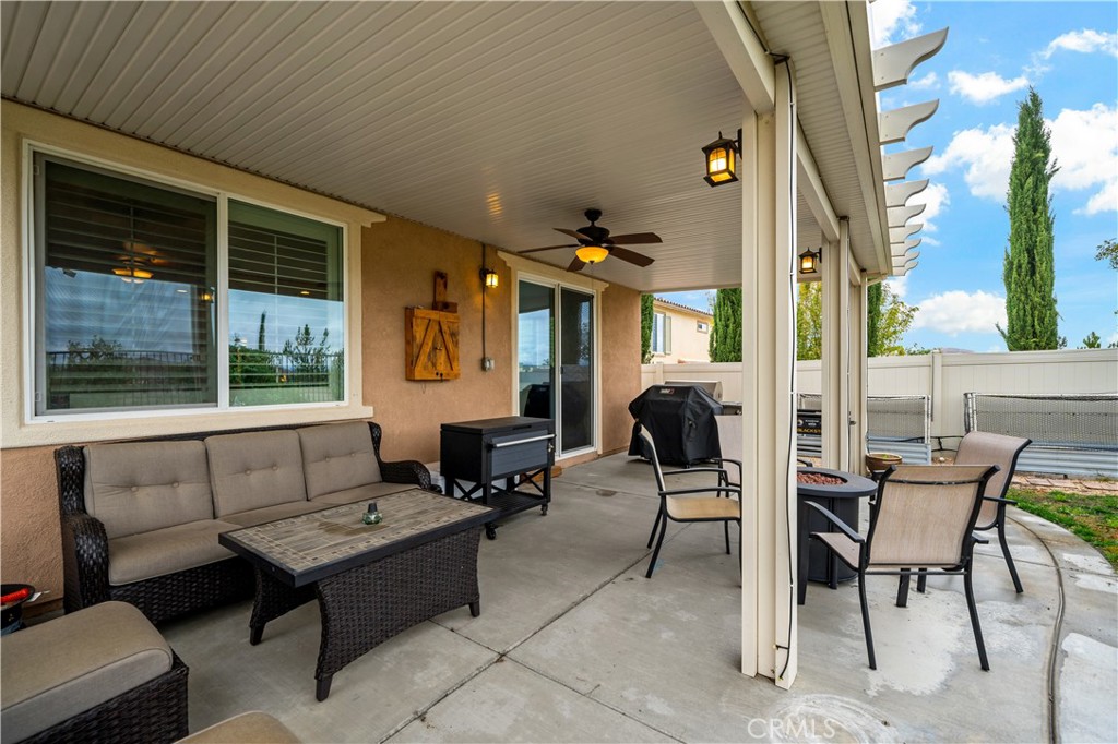 30640 Lone Pine Drive Menifee, CA 92584 - Photo 31 of 48 a building outdoor space with patio furniture and potted plants