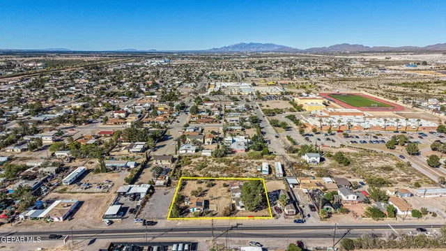an aerial view of residential building and car parked