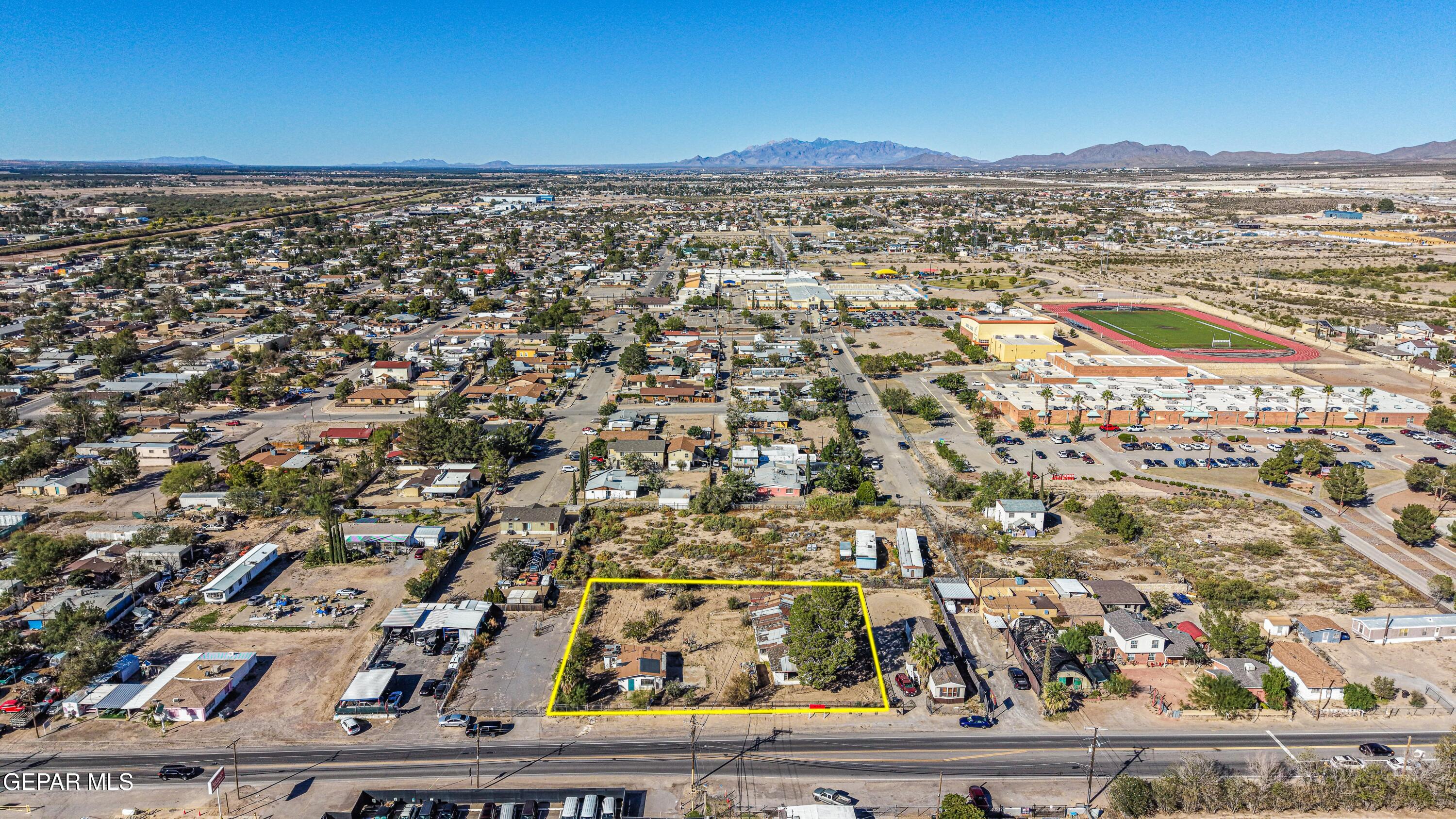 an aerial view of residential building and car parked