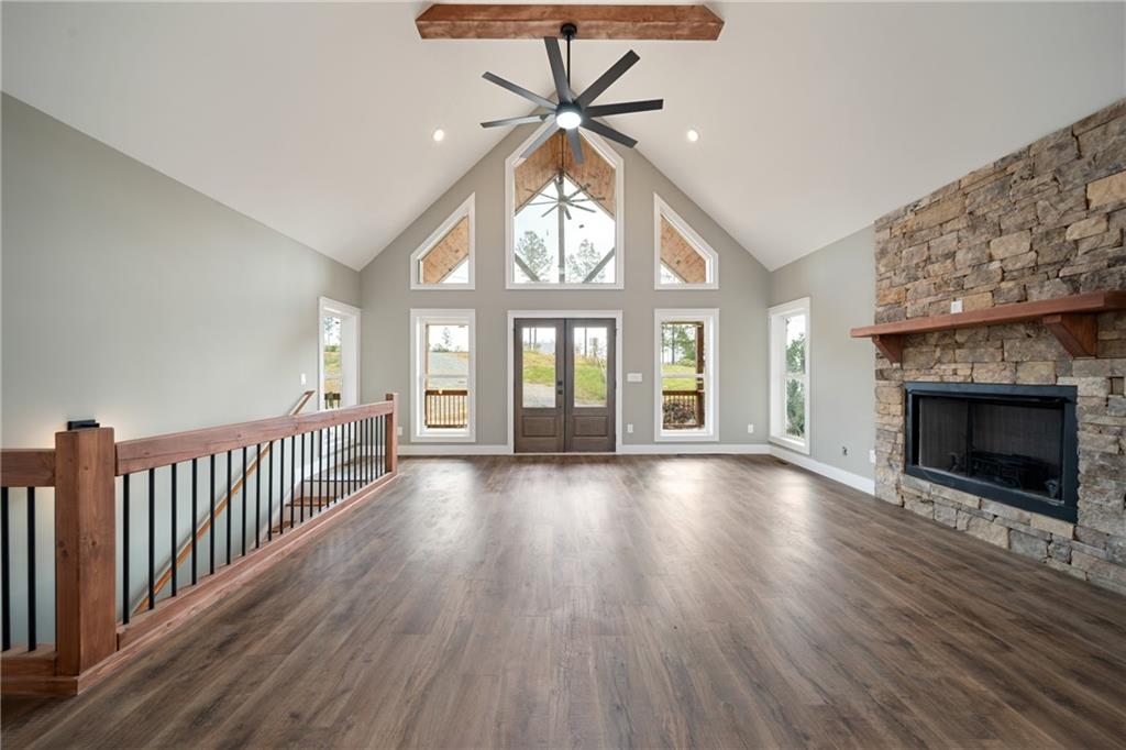 2956 Blalock Mountain Road Talking Rock, GA 30175 - Photo 5 of 65 wooden floor in an empty room with a fireplace