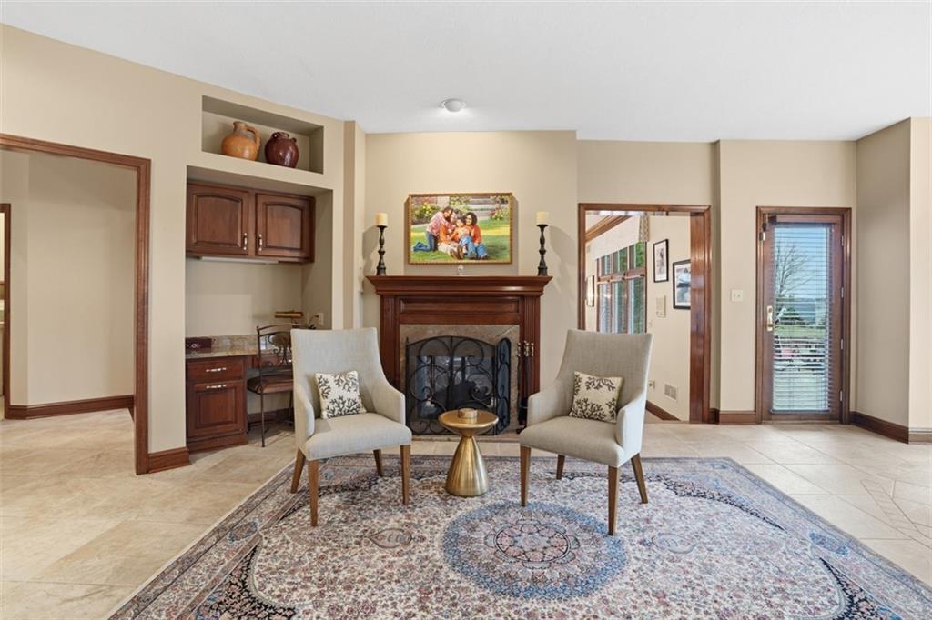 109 Brookside Lane Coraopolis, PA 15108 - Photo 16 of 50 a living room with furniture a rug and a fireplace
