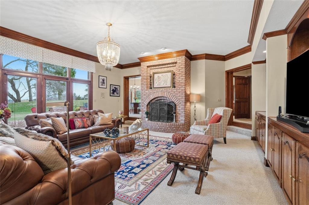 109 Brookside Lane Coraopolis, PA 15108 - Photo 21 of 50 a living room with furniture a flat screen tv and a fireplace