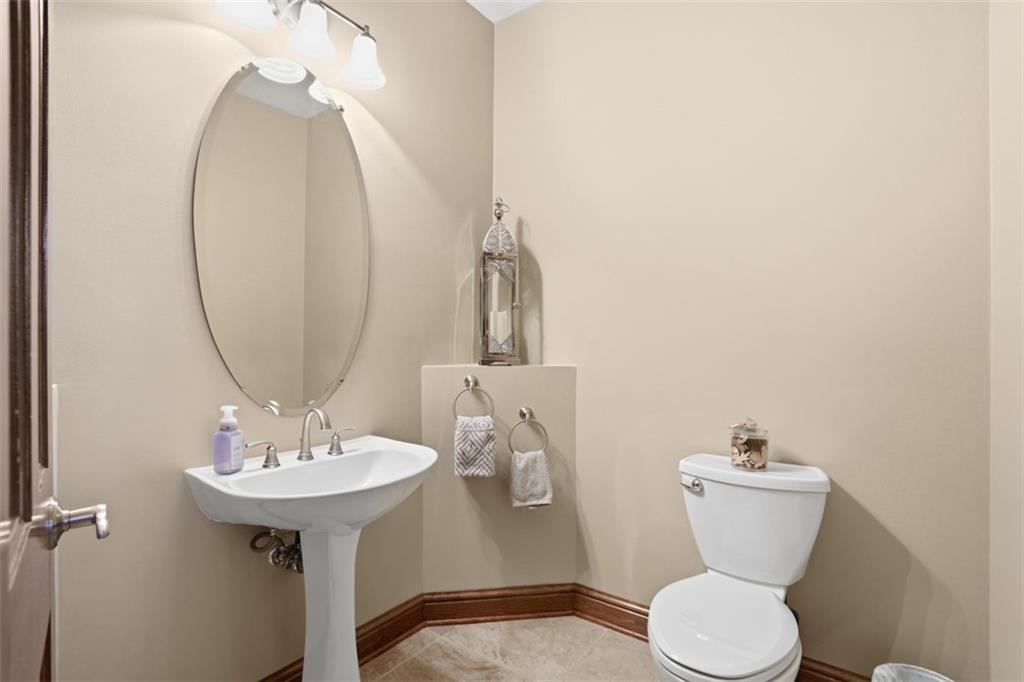 109 Brookside Lane Coraopolis, PA 15108 - Photo 22 of 50 a bathroom with a toilet sink and mirror