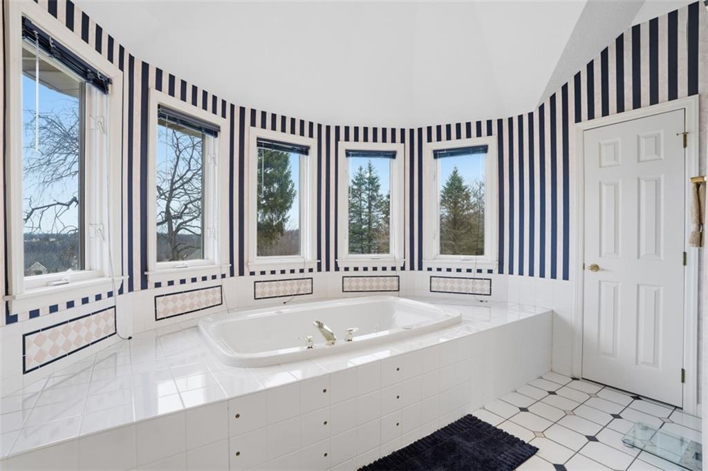 109 Brookside Lane Coraopolis, PA 15108 - Photo 29 of 50 a bathroom with a tub a sink and a large window