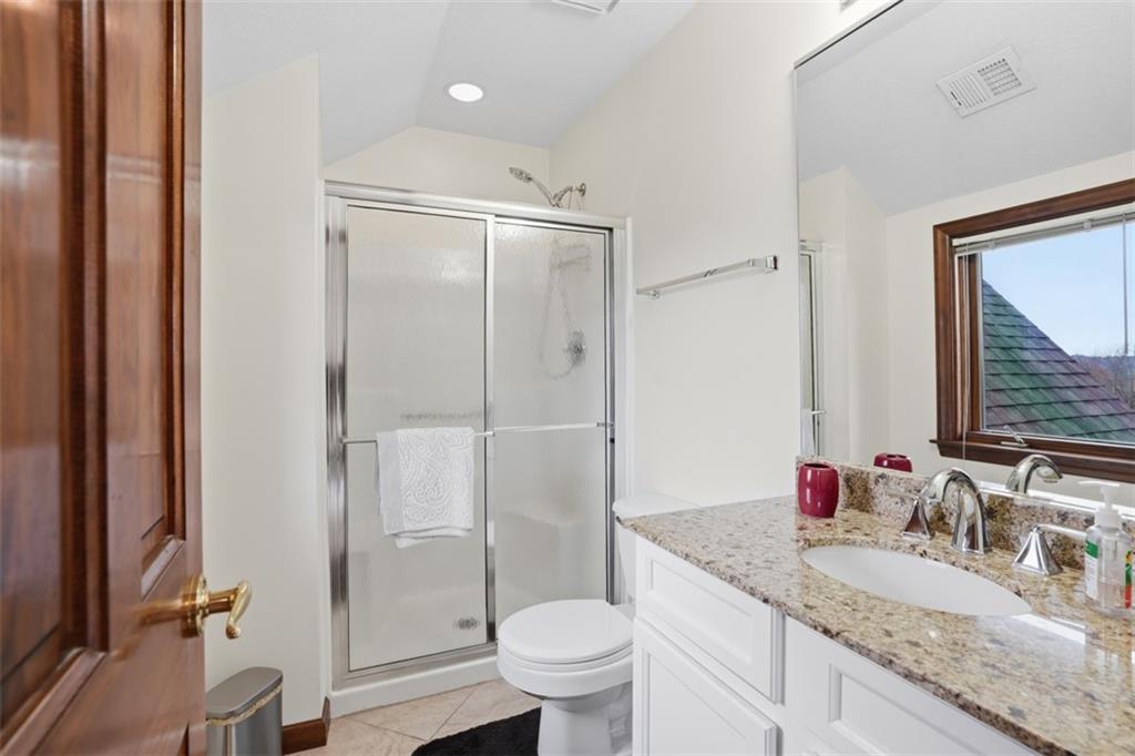 109 Brookside Lane Coraopolis, PA 15108 - Photo 33 of 50 a bathroom with a granite countertop sink toilet mirror and shower