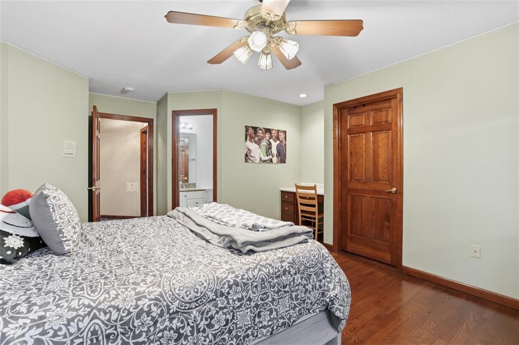109 Brookside Lane Coraopolis, PA 15108 - Photo 35 of 50 a bedroom with a bed and a chandelier