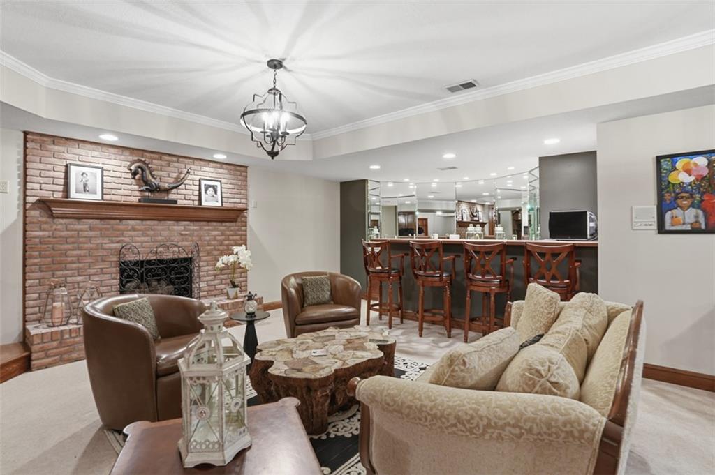 109 Brookside Lane Coraopolis, PA 15108 - Photo 39 of 50 a living room with furniture a chandelier and a fireplace