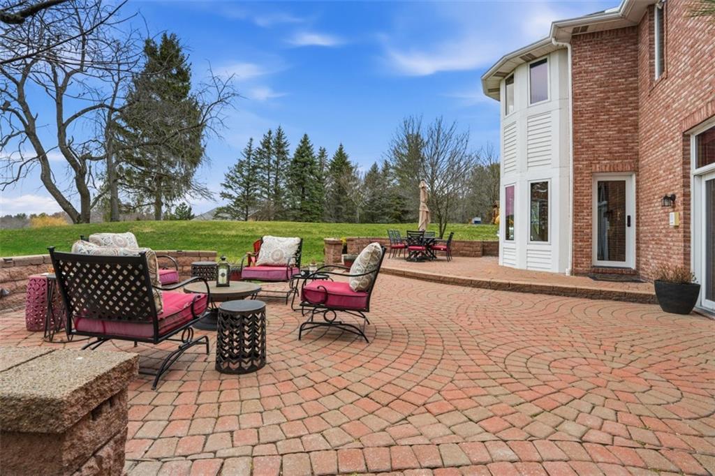 109 Brookside Lane Coraopolis, PA 15108 - Photo 44 of 50 a view of a patio with dining table and chairs with wooden floor and fence