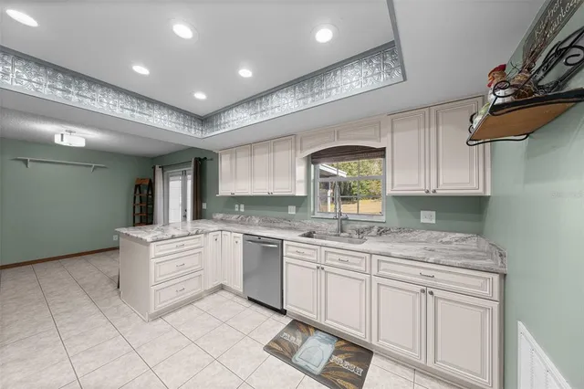 a kitchen with a stove sink and refrigerator