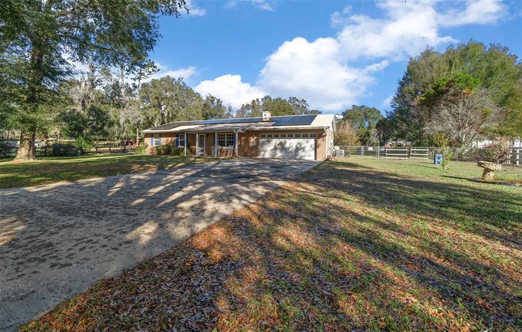 2645 Southeast 162nd Place Road Summerfield, FL 34491 - Photo 2 of 38 a view of a house with a big yard