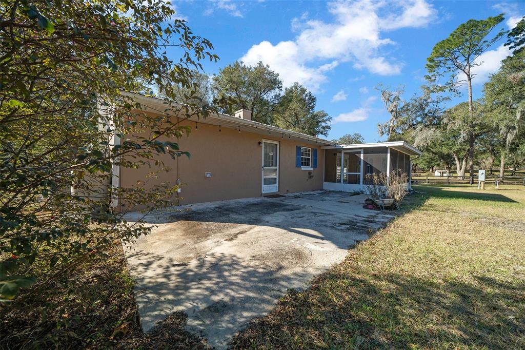 2645 Southeast 162nd Place Road Summerfield, FL 34491 - Photo 27 of 38 a view of a house with a yard