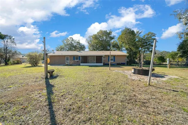 a view of grassy field with trees