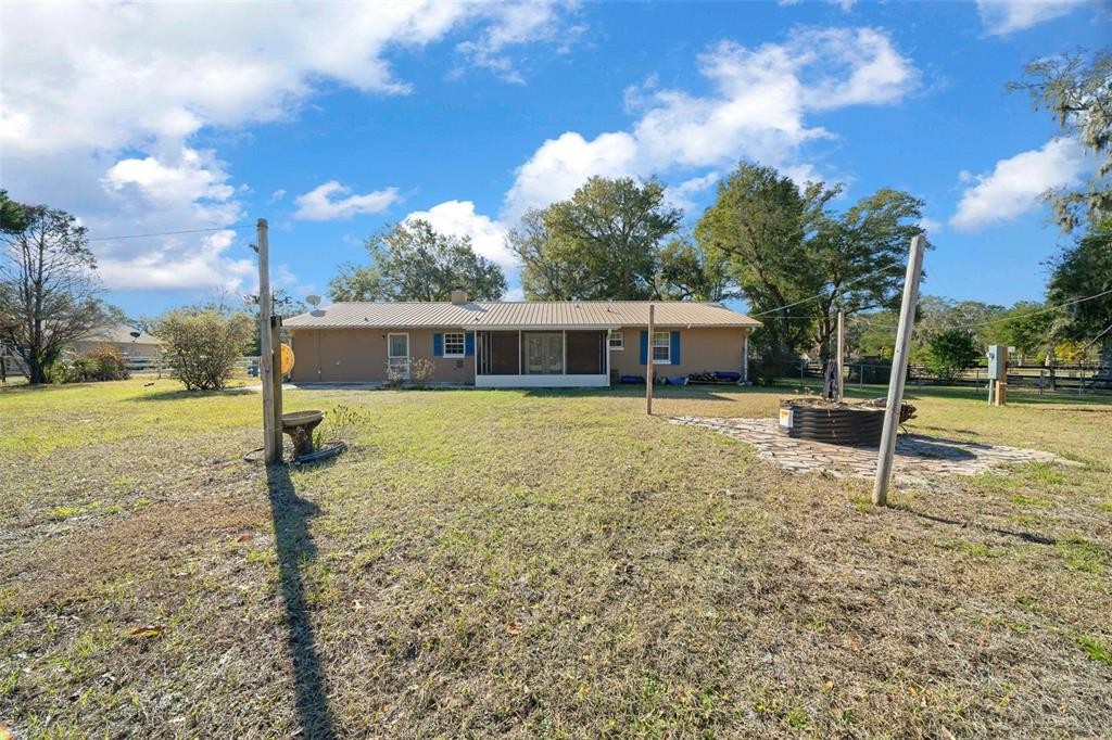 2645 Southeast 162nd Place Road Summerfield, FL 34491 - Photo 29 of 38 a view of a house with a yard